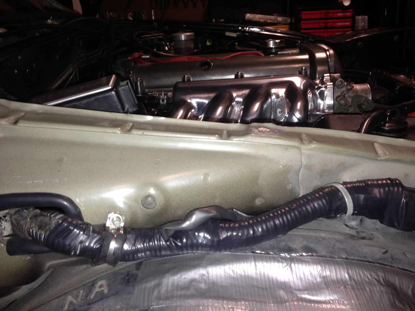 I have tucked the passenger side harness in the engine bay by re-routing it behind the fender.
